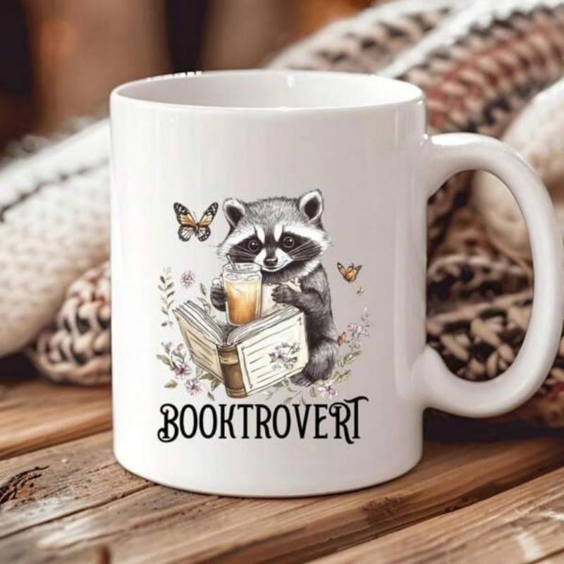 Tailorly White Ceramic 11 oz Mug - Booktrovert Watercolor Style Reading An Antique Book Among Wildflowers And Tiny Butterflies Raccoon