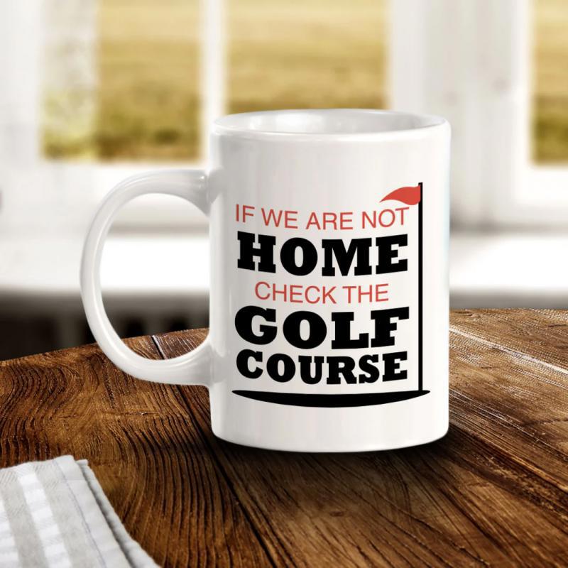 Tailorly White Ceramic 11 oz Mug - If We Are Not Home Check The Golf Course Vibrant Red Golf Flag Standing Beside Bold Humorous Sporty Typography Flag