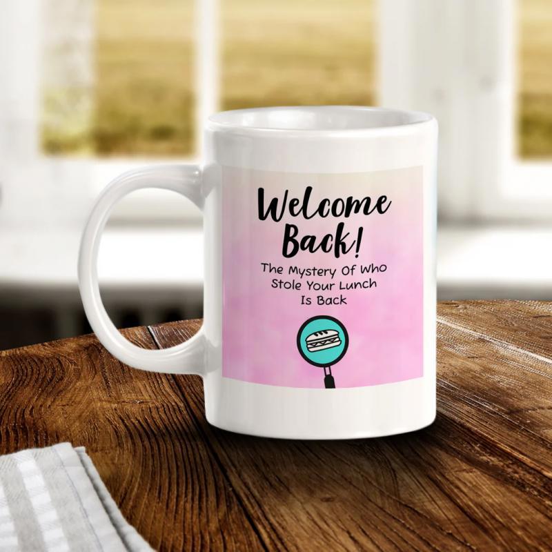 Tailorly White Ceramic 11 oz Mug - Welcome Back The Mystery Of Who Stole Your Lunch Is Back Pink Watercolor Background With Playful Text Magnifying Glass Icon Mug