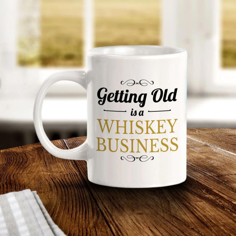 Tailorly White Ceramic 11 oz Mug - Getting Old Is A Whiskey Business White Ceramic Vessel Resting On A Rustic Wooden Surface Mug