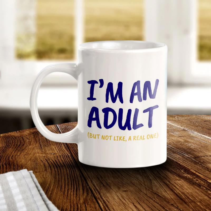 Tailorly White Ceramic 11 oz Mug - I'm An Adult But Not Like A Real One Minimalist White Ceramic Vessel Featuring Bold Colorful Typography On Smooth Surface Mug
