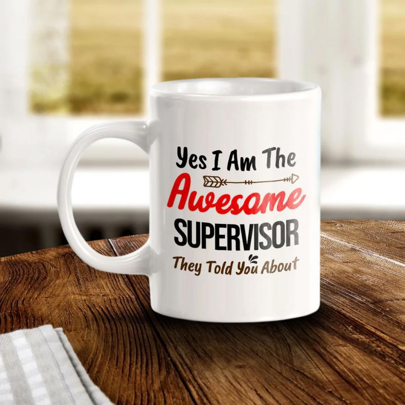 Tailorly White Ceramic 11 oz Mug - Yes I Am The Awesome Supervisor They Told You About Classic Ceramic White Vessel Resting On A Dark Natural Wood Grain Mug