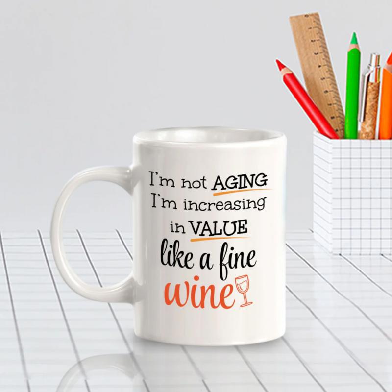 Tailorly White Ceramic 11 oz Mug - Im Not Aging Im Increasing In Value Like A Fine Wine Classic Black And Orange Typography Featuring A Small Outlined Wine Glass