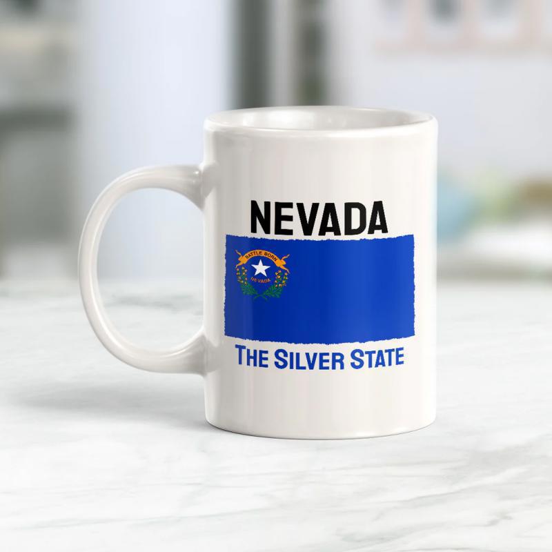 Tailorly White Ceramic 11 oz Mug - Nevada The Silver State Vibrant Blue Banner Showcasing Golden Sagebrush And Silver Star Design Flag
