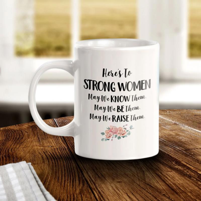 Tailorly White Ceramic 11 oz Mug - Heres To Strong Women May We Know Them May We Be Them May We Raise Them Small Delicate Pink Flowers With Green Leaves Resting
