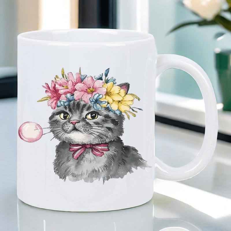 Tailorly White Ceramic 11 oz Mug - Charming Gray Tabby Wearing Vibrant Floral Crown Blowing A Pink Bubble Cat