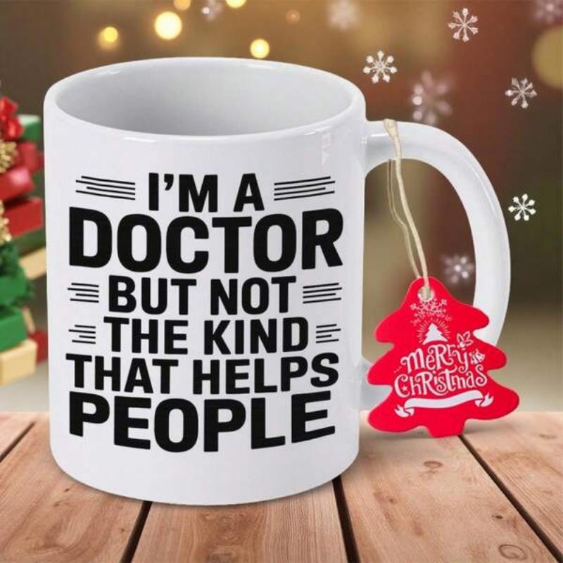 Tailorly White Ceramic 11 oz Mug - Im A Doctor But Not The Kind That Helps People With Bold Black Lettering Beside Christmas Ornament Mug