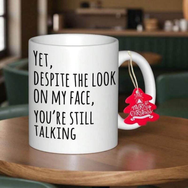 Tailorly White Ceramic 11 oz Mug - Yet Despite The Look On My Face Youre Still Talking Sleek Minimalist White Ceramic Kitchenware Featuring A Festive Red Holiday