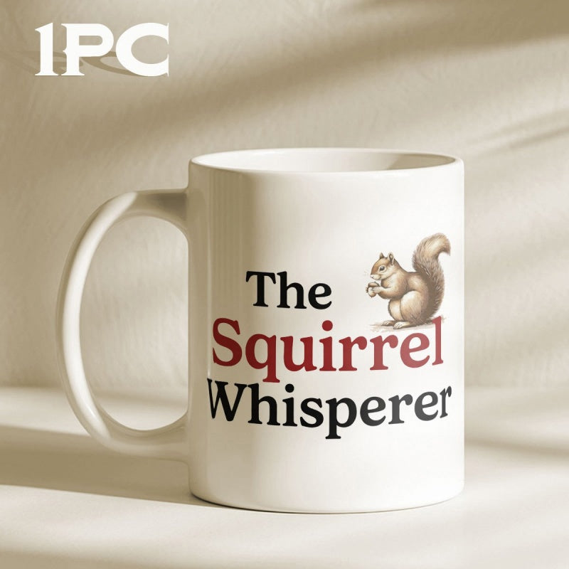 Tailorly White Ceramic 11 oz Mug - The Squirrel Whisperer Small Brown Squirrel Holding A Nut Sitting Above Bold Text Squirrel