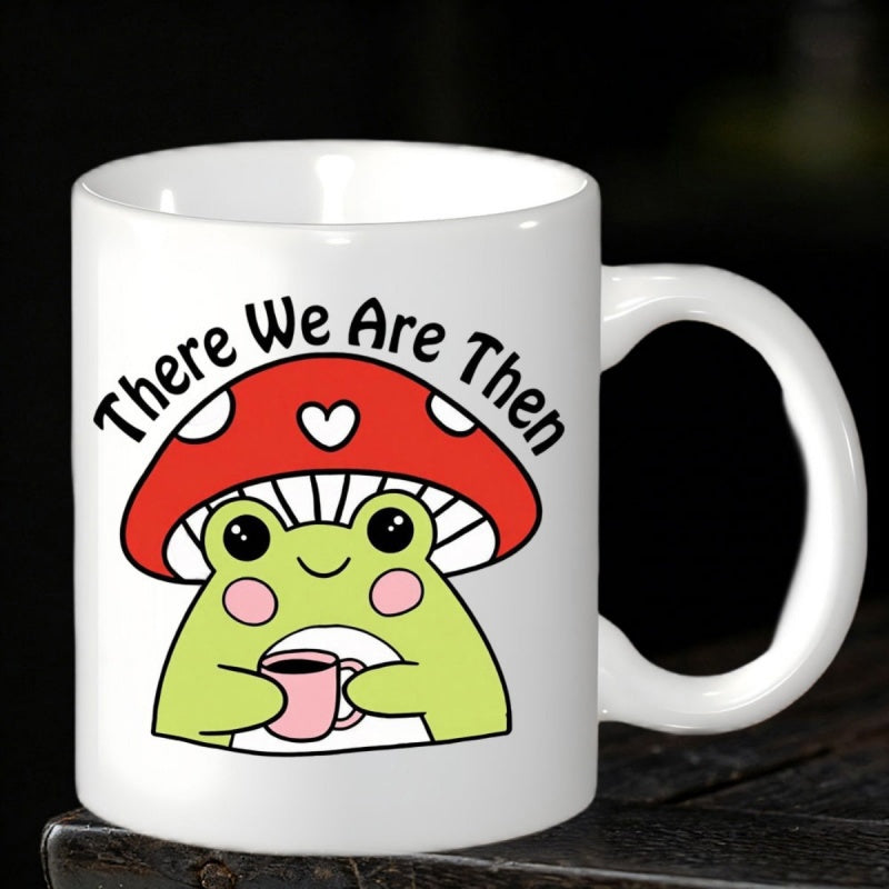 Tailorly White Ceramic 11 oz Mug - There We Are Then Cute Green Frog Wearing Red Mushroom Heart Hat Holding Small Cup Frog