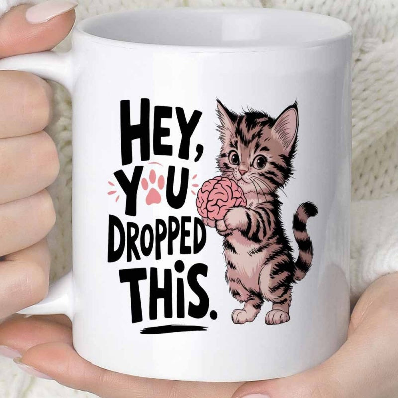 Tailorly White Ceramic 11 oz Mug - Hey You Dropped This Adorable Striped Tabby Standing Upright Holding A Small Pink Human Brain Kitten