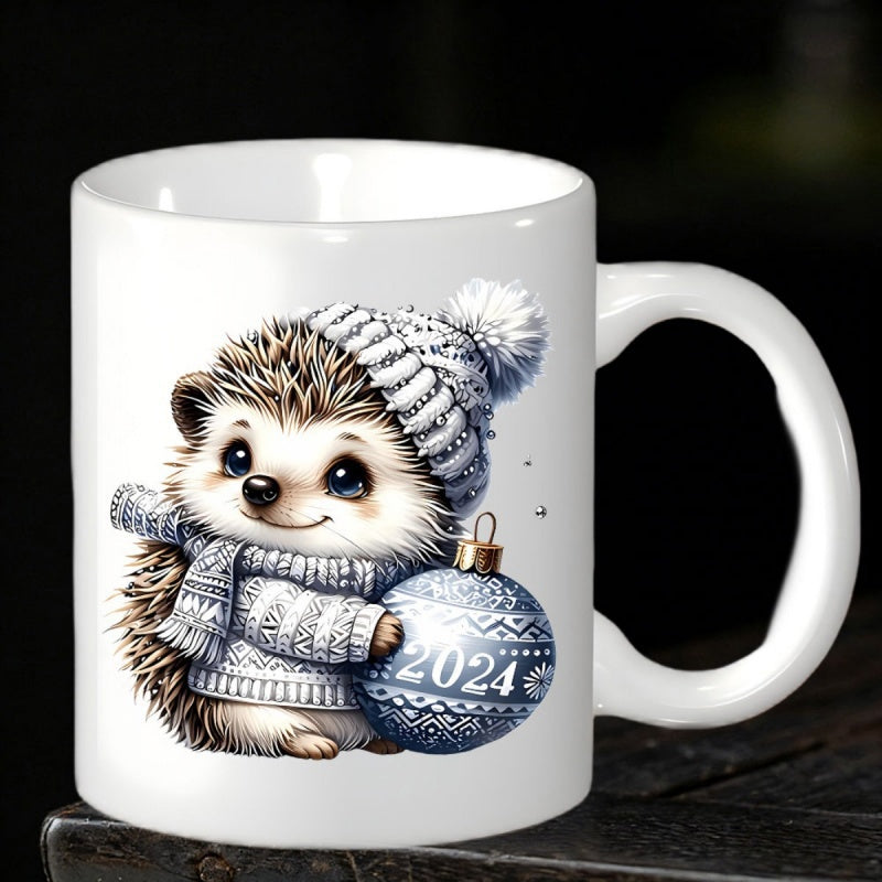 Tailorly White Ceramic 11 oz Mug - 2024 Adorable Little Hedgehog Wearing Knitted Winter Accessories Holding A Festive Christmas Bauble Hedgehog