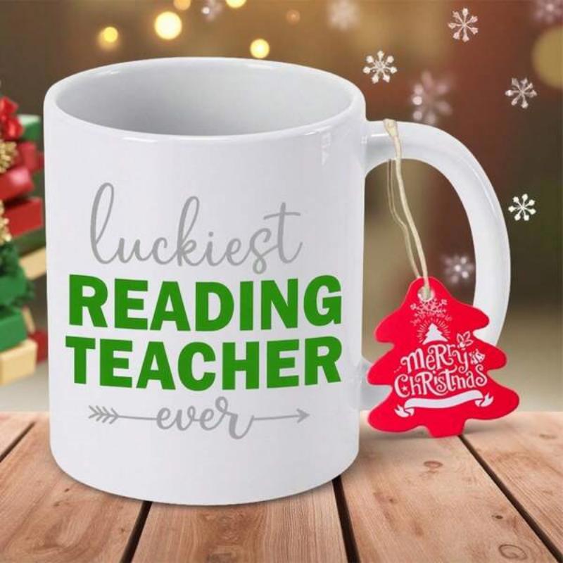 Tailorly White Ceramic 11 oz Mug - Luckiest Reading Teacher Ever Merry Christmas Clean Featuring Bold Green Letters On Wooden Table Mug