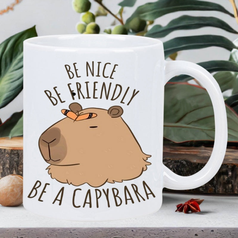 Tailorly White Ceramic 11 oz Mug - Be Nice Be Friendly Be A Capybara Adorable Cartoon Head With Orange Butterfly Resting On Its Peaceful Nose Capybara