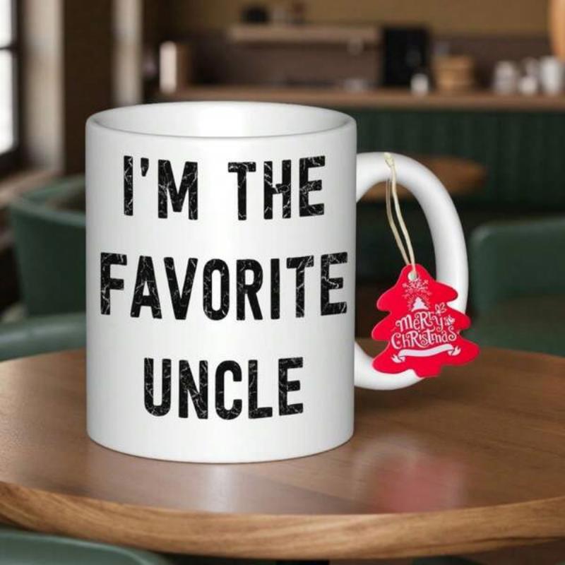 Tailorly White Ceramic 11 oz Mug - Im The Favorite Uncle Classic White Ceramic Material Standing On Wooden Surface Table Mug