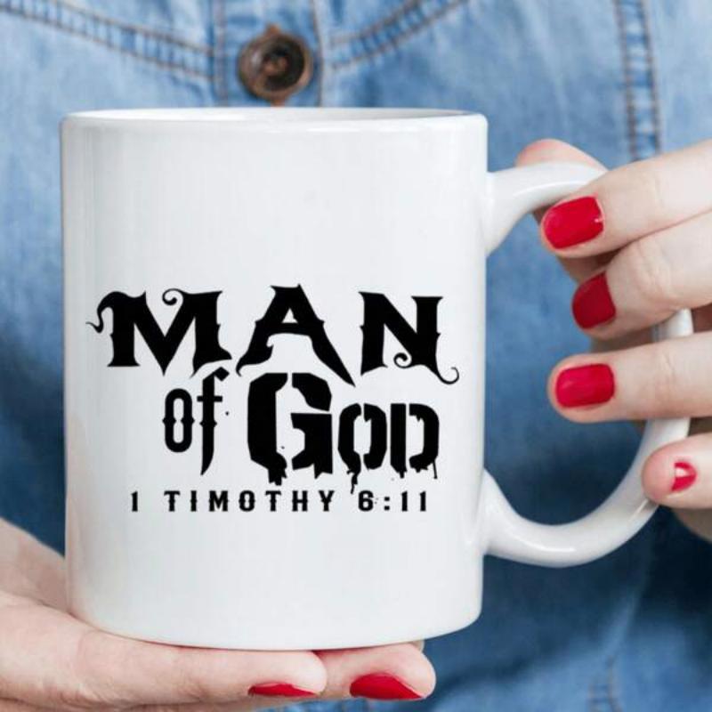 Tailorly White Ceramic 11 oz Mug - Man Of God 1 Timothy 6 11 Stylized Bold Gothic Lettering With Religious Scriptural Verse Reference Mug