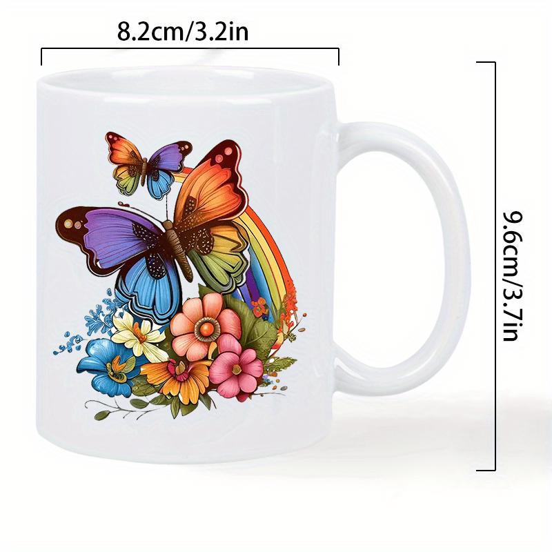 Tailorly White Ceramic 11 oz Mug - Vibrant Colorful Wings Dancing Among Enchanting Floral Blooms Under Rainbow Butterfly