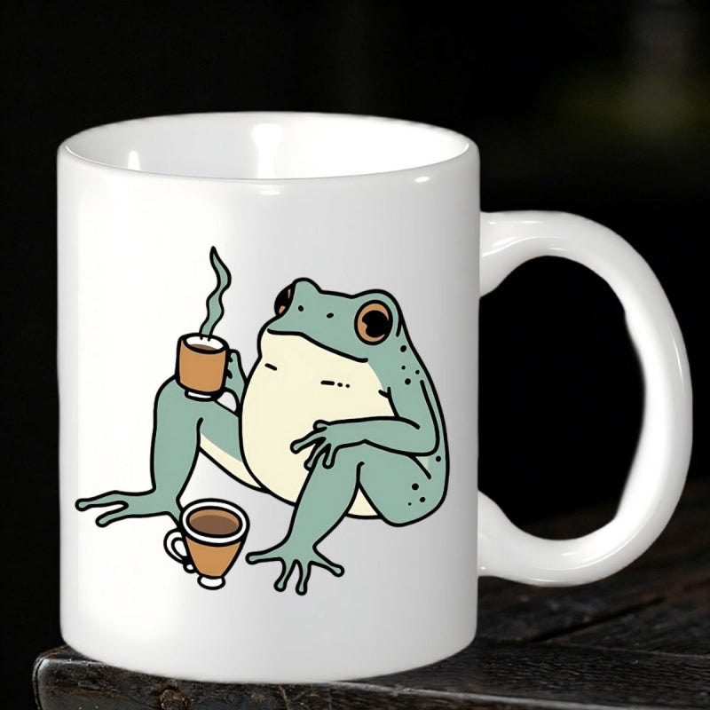 Tailorly White Ceramic 11 oz Mug - Whimsical Seated Green Frog Holding A Steaming Cup Of Morning Coffee Frog