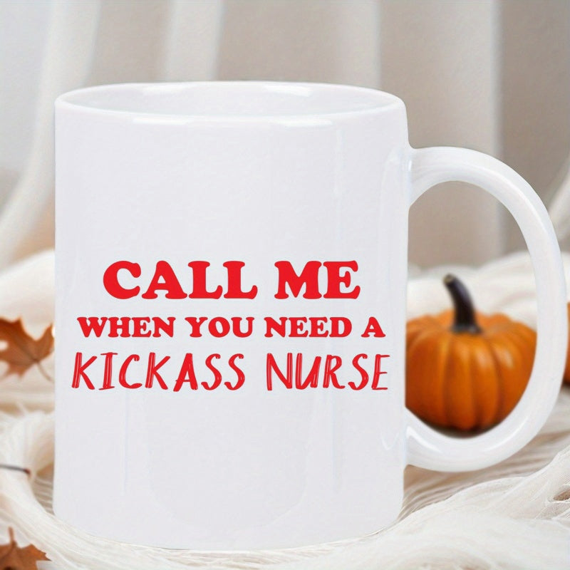 Tailorly White Ceramic 11 oz Mug - Call Me When You Need A Kickass Nurse Elegant White Ceramic Vessel Sitting On White Fabric Beside Small Pumpkin Mug