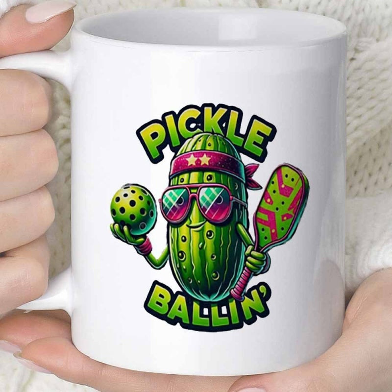 Tailorly White Ceramic 11 oz Mug - Pickle Ballin' Vibrant Cartoon Character Wearing Sunglasses Holding A Sports Paddle Pickle