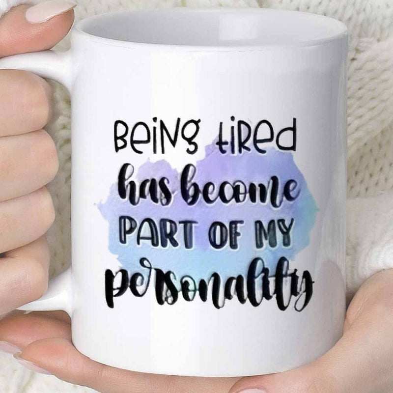Tailorly White Ceramic 11 oz Mug - Being Tired Has Become Part Of My Personality Soft Purple And Blue Watercolor Splash Background Behind Bold Playful Text Mug