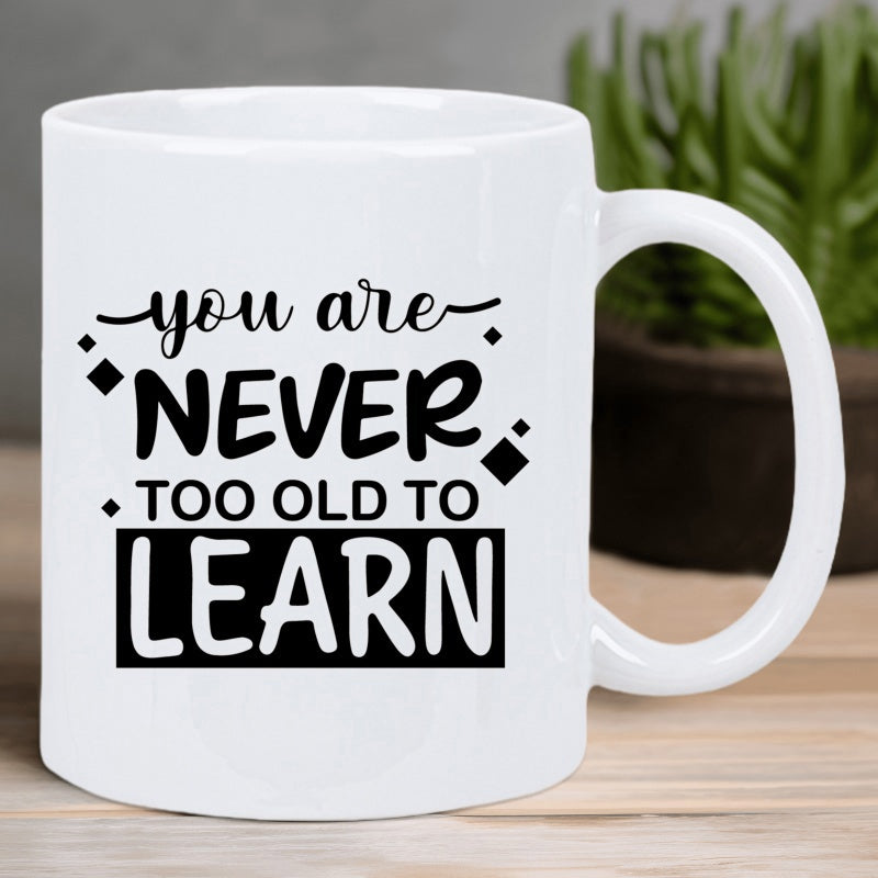 Tailorly White Ceramic 11 oz Mug - You Are Never Too Old To Learn Bold Black Minimalist Typography Surrounded By Small Decorative Geometric Rhombus Accents Mug