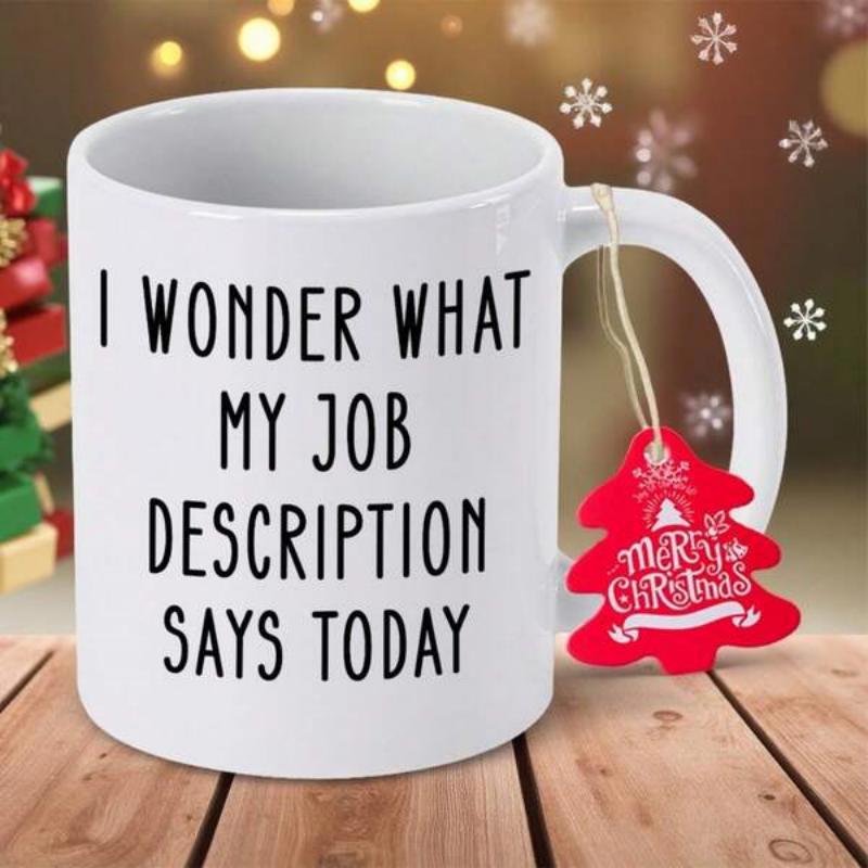 Tailorly White Ceramic 11 oz Mug - I Wonder What My Job Description Says Today Merry Christmas Polished White Ceramic Body Resting On Rustic Table With Hanging Red