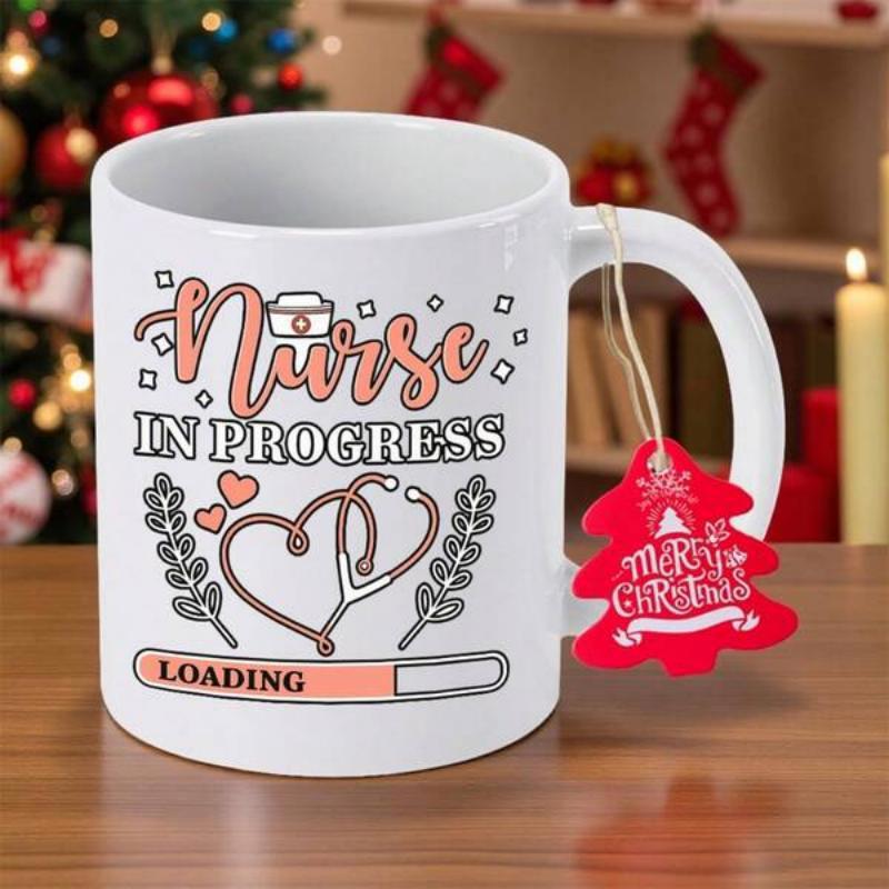 Tailorly White Ceramic 11 oz Mug - Nurse In Progress Loading Heart Shaped Stethoscope With Small Nurse Cap And Decorative Laurel Leaves Nurse