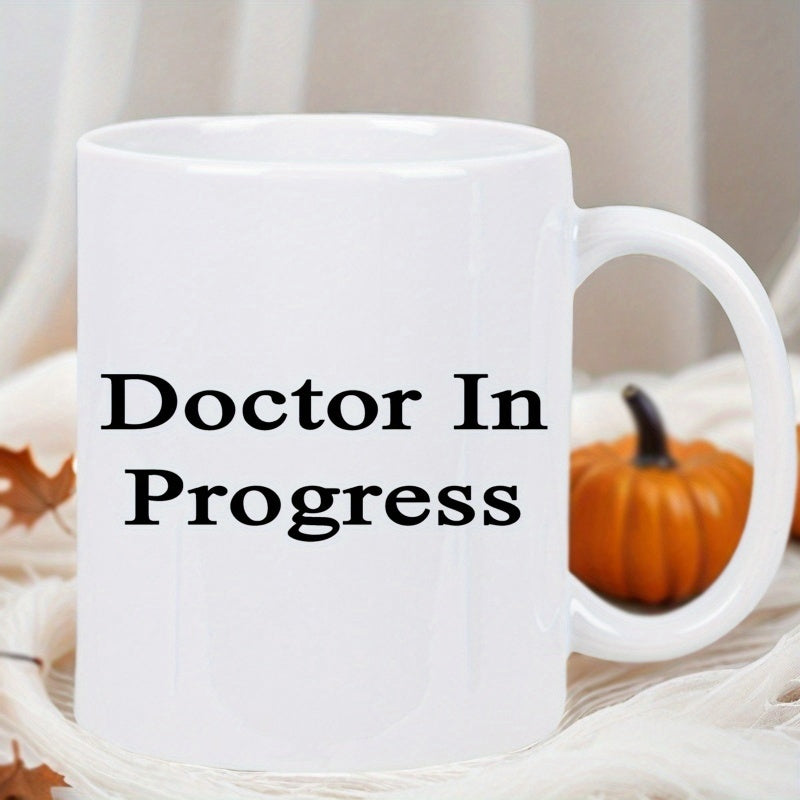 Tailorly White Ceramic 11 oz Mug - Doctor In Progress Simple Minimalist White Ceramic Kitchenware Placed On A Soft Fabric Background Mug