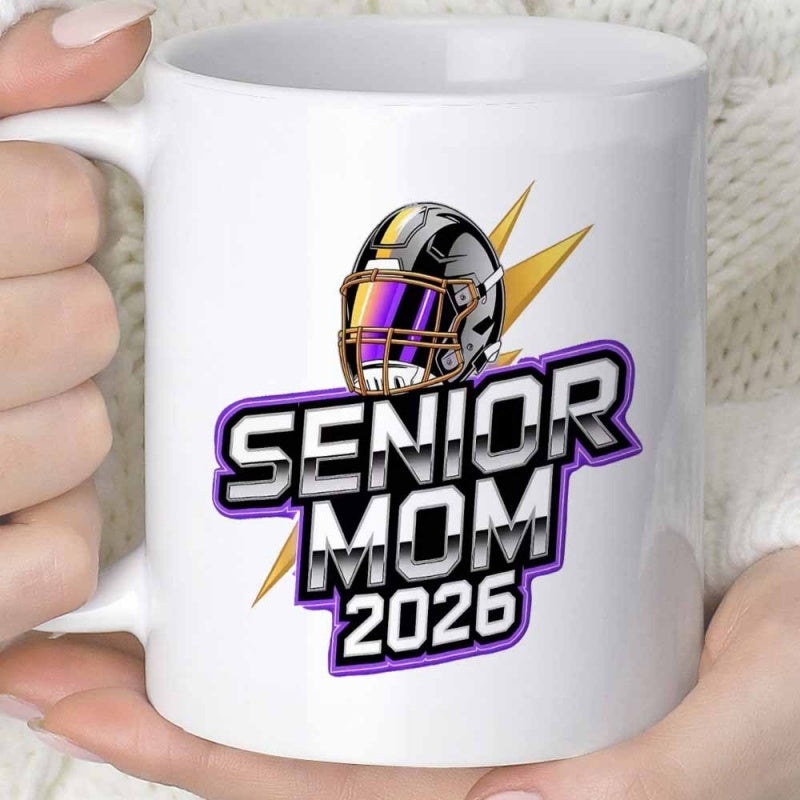 Tailorly White Ceramic 11 oz Mug - Senior Mom 2026 Metallic Sporty Protective Gear Surrounded By Golden Lightning Bolts Helmet