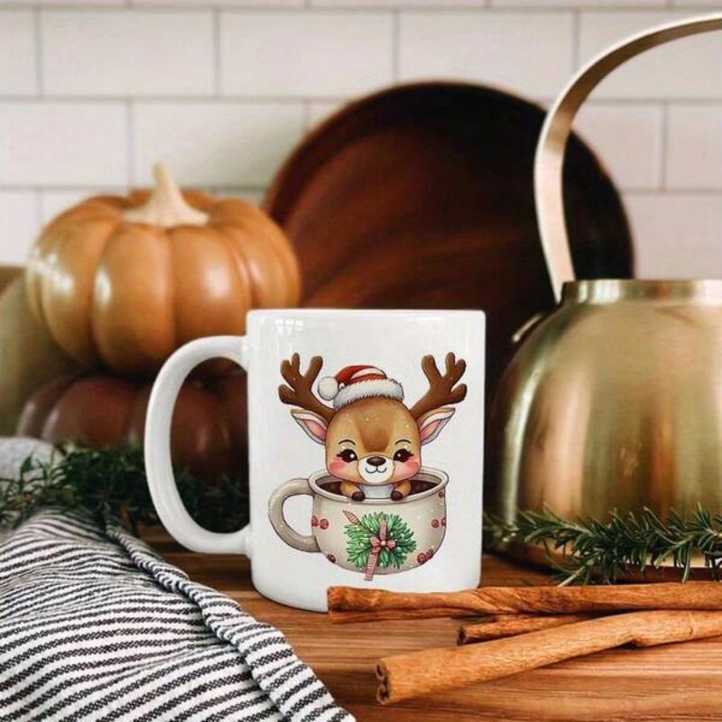 Tailorly White Ceramic 11 oz Mug - Adorable Festive Cartoon Character Wearing Santa Hat Sitting In Ceramic Cup Reindeer