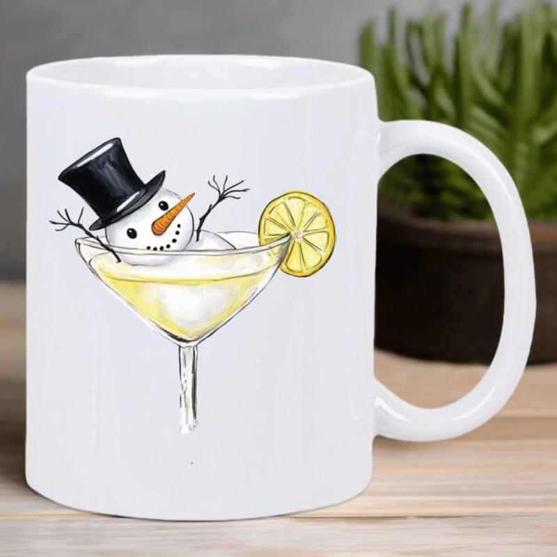 Tailorly White Ceramic 11 oz Mug - Whimsical Festive Character Resting Inside A Glass With A Lemon Garnish Snowman