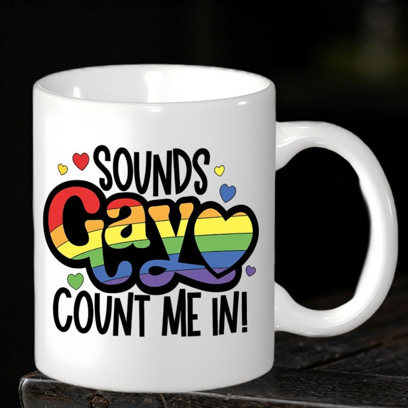 Tailorly White Ceramic 11 oz Mug - Sounds Gay Count Me In Rainbow Colored Pride Slogan Surrounded By Small Colorful Hearts Mug