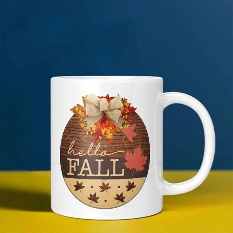 Tailorly White Ceramic 11 oz Mug - Hello Fall Rustic Circular Wood Grain Background With Autumn Maple Leaves And Bow Sign