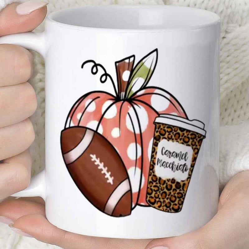 Tailorly White Ceramic 11 oz Mug - Caramel Macchiato Leopard Pattern Coffee Cup Beside Brown Football And Autumn Polka Dot Pumpkin