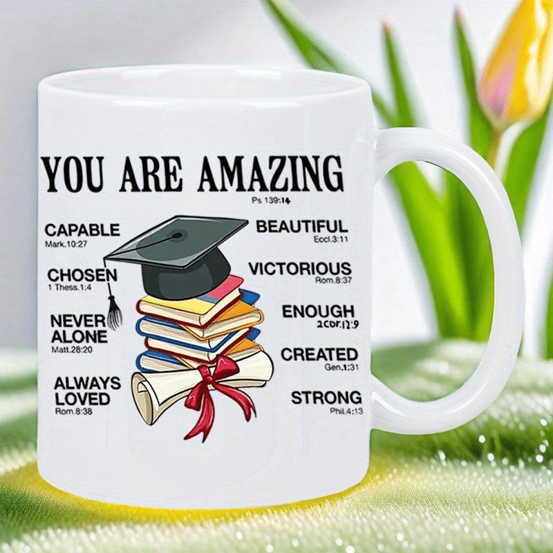 Tailorly White Ceramic 11 oz Mug - You Are Amazing Academic Graduation Hat Resting On Stacked Colorful Books Beside Tied Diploma Mortarboard