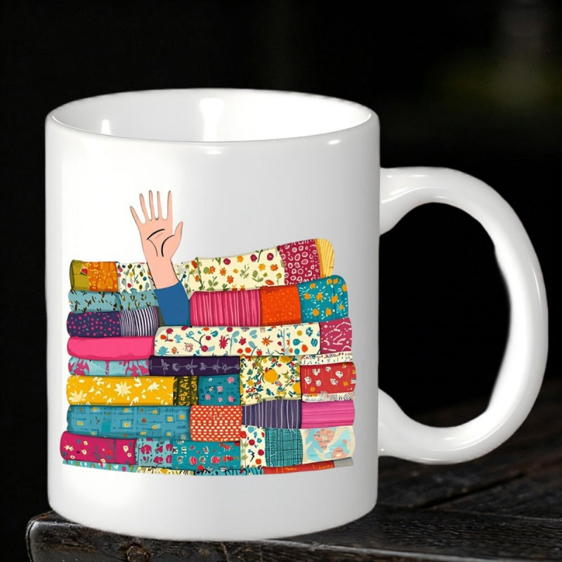 Tailorly White Ceramic 11 oz Mug - Colorful Hand Reaching Out From Under A Stack Of Vibrant Patterned Quilt