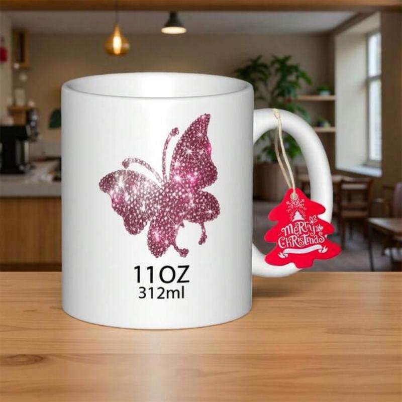 Tailorly White Ceramic 11 oz Mug - Merry Christmas Sparkling Pink Butterfly With Glitter Wings Resting On White Surface Butterfly