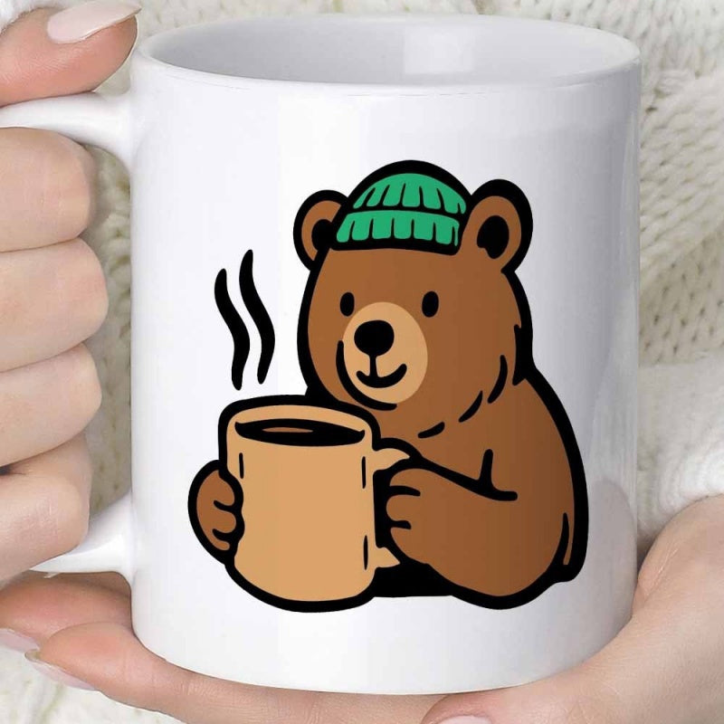Tailorly White Ceramic 11 oz Mug - Cute Brown Cartoon Animal Wearing Green Beanie Holding Steaming Coffee Cup Bear