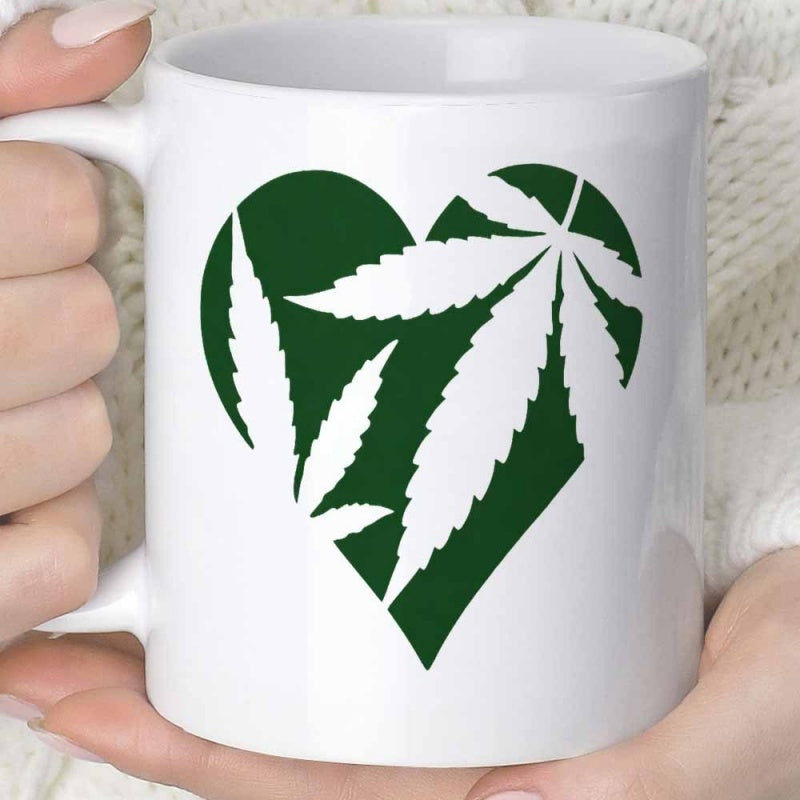 Tailorly White Ceramic 11 oz Mug - Vibrant Green Graphic With Silhouetted White Cannabis Leaves Inside Heart