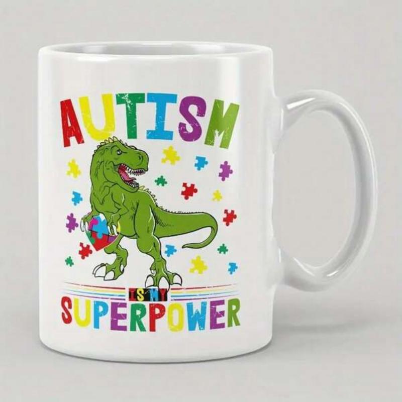 Tailorly White Ceramic 11 oz Mug - Autism Is My Superpower Vibrant Green Dinosaur Holding A Heart Among Colorful Scattered Puzzle Pieces Dinosaur