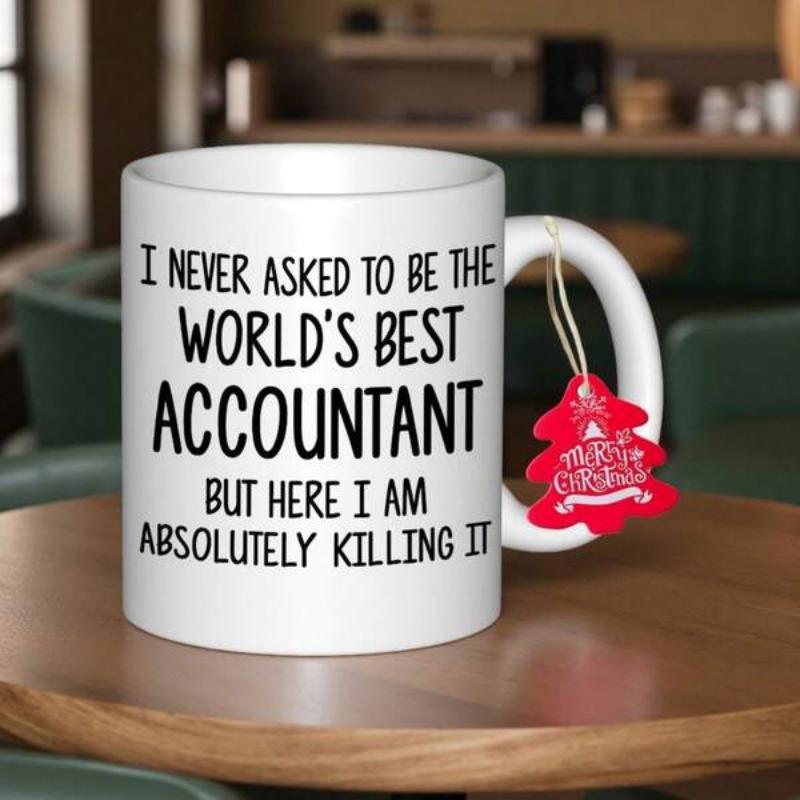 Tailorly White Ceramic 11 oz Mug - I Never Asked To Be The World's Best Accountant But Here I Am Absolutely Killing It Plain White Ceramic Vessel Resting On A