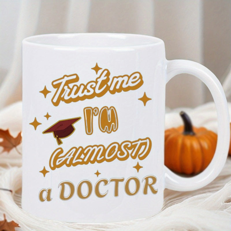 Tailorly White Ceramic 11 oz Mug - Trust Me Im Almost A Doctor Sparkling Golden Lettering Featuring A Small Academic Graduation Cap Design Mug