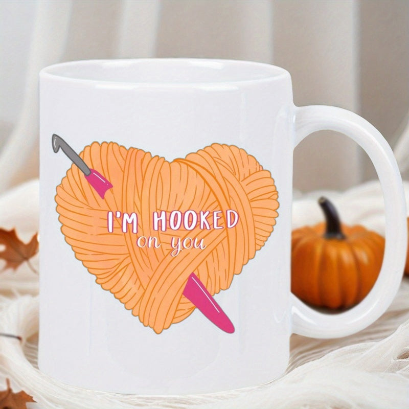 Tailorly White Ceramic 11 oz Mug - Im Hooked On You Heart Shaped Orange Yarn With A Pink Crochet Hook Passing Through Heart