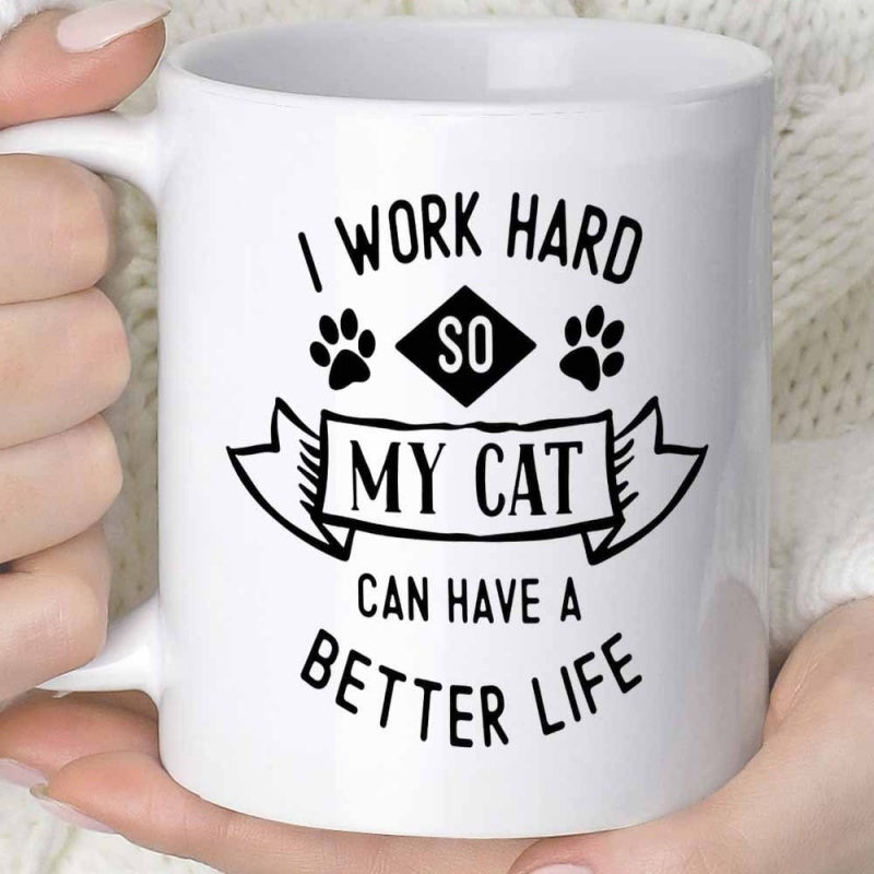 Tailorly White Ceramic 11 oz Mug - I Work Hard So My Cat Can Have A Better Life Stylized Black Text Featuring Decorative Paw Prints And Vintage Ribbon Frame Cat