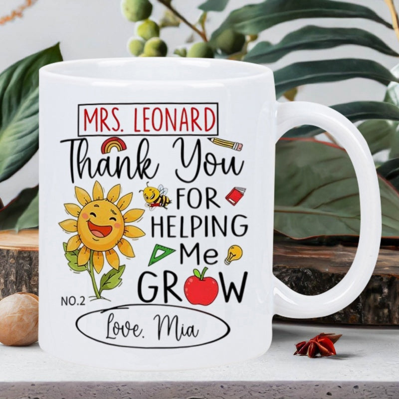 Tailorly White Ceramic 11 oz Mug - Mrs Leonard Thank You For Helping Me Grow Love Mia Smiling Yellow Sunflower Surrounded By Small School Supplies And Red Apple