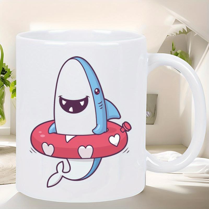 Tailorly White Ceramic 11 oz Mug - Cheerful Blue Cartoon Character Floating Inside Pink Heart Patterned Water Ring Shark