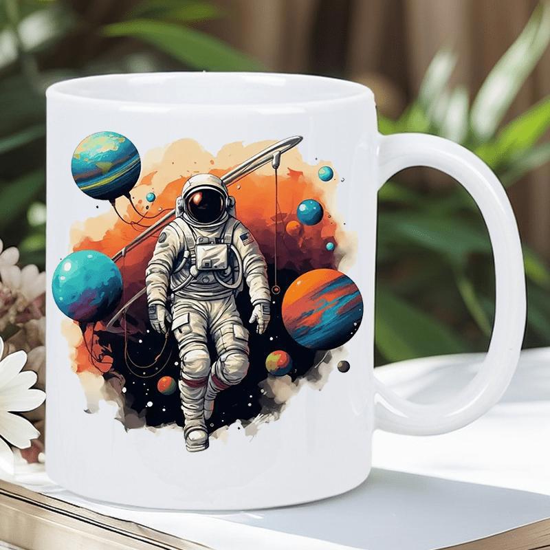 Tailorly White Ceramic 11 oz Mug - Floating Among Colorful Planets Holding A Long Fishing Rod In Outer Space Astronaut