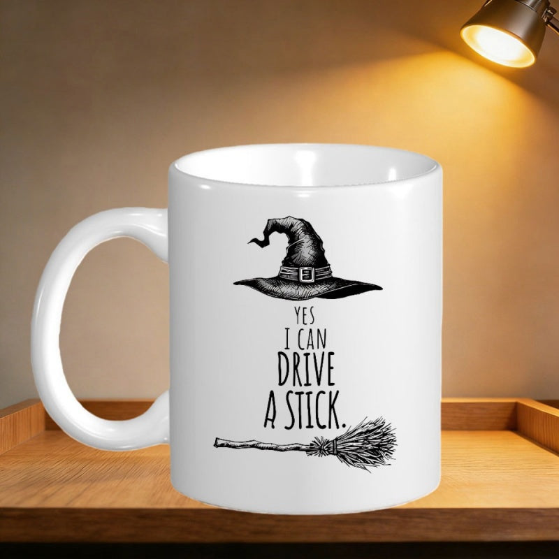 Tailorly White Ceramic 11 oz Mug - Yes I Can Drive A Stick Pointed Buckled Antique Style Above A Rustic Flying Straw Textured Broomstick