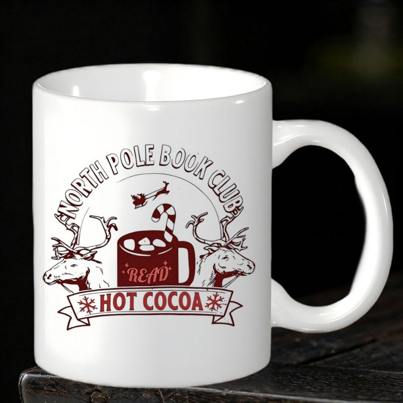 Tailorly White Ceramic 11 oz Mug - North Pole Book Club Hot Cocoa Read Festive Winter Scene Featuring Reindeer And Steaming Cup Of Delicious Hot Cocoa Mug
